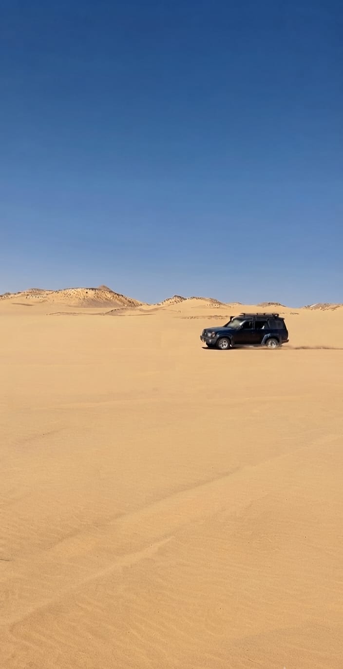 4x4 driving across the sand dunes of Egypt's Western Desert