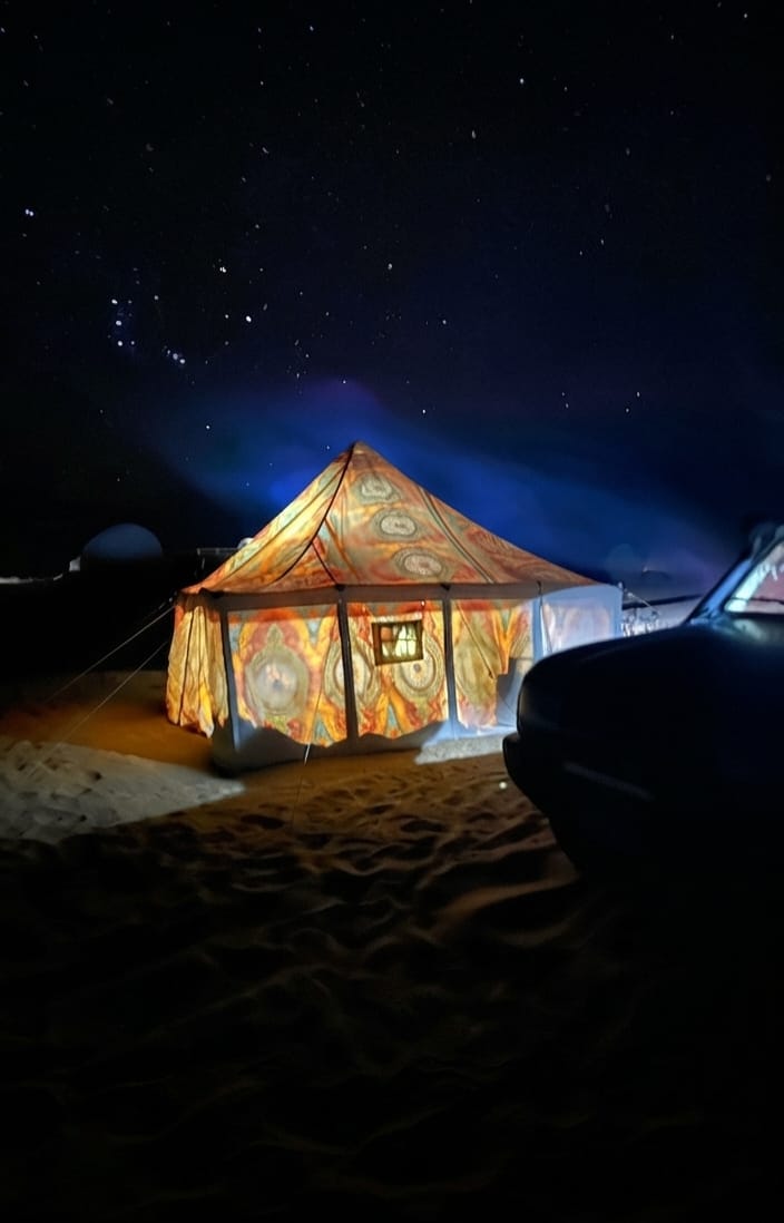 Bedouin camp tent under a starry desert sky